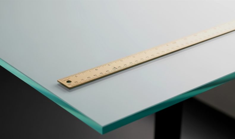Close-up of a ruler on a glass surface